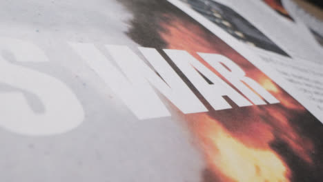 Extreme-Close-Up-Newspaper-Headline-This-Is-War