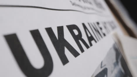 Slow-Tracking-Close-Up-Newspaper-Headline-Ukraine-Hit-Back