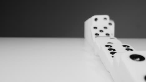 Tracking-Shot-With-Dominoes-Falling-