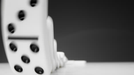 Close-Up-of-Dominoes-Falling-with-Copy-Space