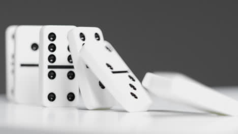 Mid-Shot-of-Dominoes-Knocking-Over-