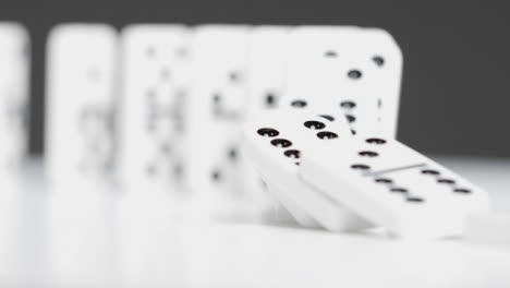Mid-Shot-Of-Dominoes-Knocking-Over-
