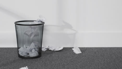 Tracking-In-Shot-of-Paper-Being-Thrown-into-Bin