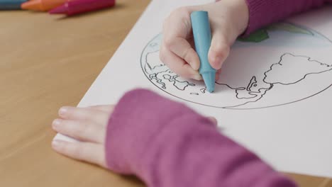 Tracking-Shot-of-Child-Colouring