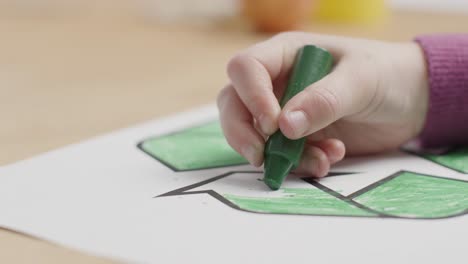 Close-Up-of-Child-Using-Green-Crayon