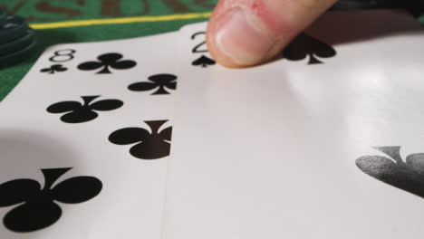 Extreme-Close-Up-of-Someone-Placing-Card
