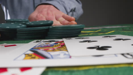 Low-Angle-Shot-of-Person-Putting-in-Tokens