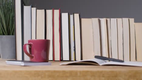 Tracking-Shot-of-Books-on-Desk-01