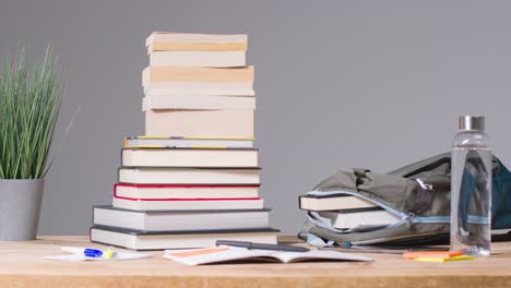 Stop-Motion-Shot-of-Books-and-Backpack-On-Desk