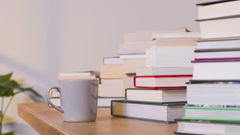 Stop-Motion-Shot-of-Stacks-of-Books-On-Desk