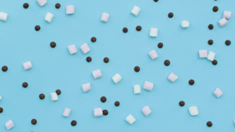 Descending-Top-Down-Shot-of-Rotating-Chocolate-Chips-and-Marshmallows