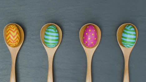 Tracking-Shot-of-Easter-Eggs-In-Wooden-Spoons
