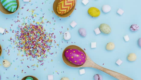 Tracking-Shot-of-Easter-Eggs-In-Wooden-Spoons-with-Confectionary