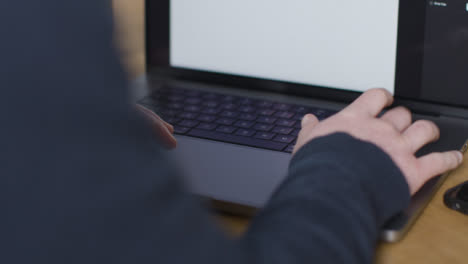 Over-the-Shoulder-Shot-of-Person-Typing-On-New-Apple-MacBook-Pro-02