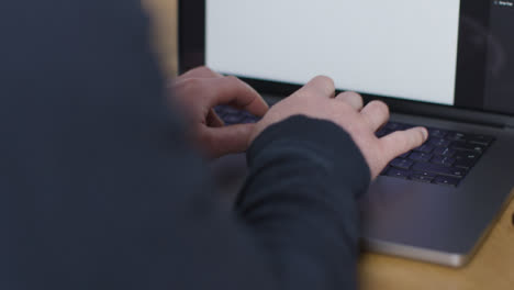 Over-the-Shoulder-Shot-of-Person-Typing-On-New-Apple-MacBook-Pro-03