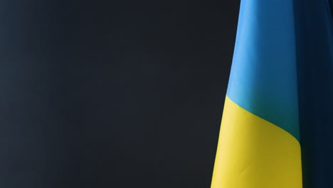 Close-Up-Shot-of-Ukraine-Flag-Admist-Some-Haze