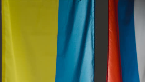 Close-Up-Shot-of-Hanging-Ukrainian-and-Russian-Flags-01