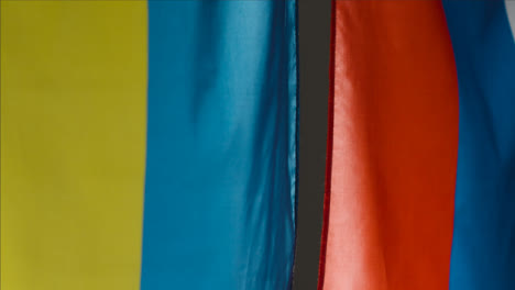 Close-Up-Shot-of-Hanging-Ukrainian-and-Russian-Flags-02