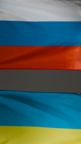 Vertical-Tracking-Shot-of-Ukrainian-and-Russian-Flags