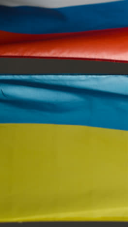 Vertical-Shot-of-Ukrainian-and-Russian-Flags-01