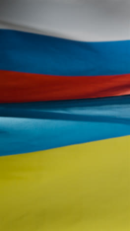 Vertical-Shot-of-Ukrainian-and-Russian-Flags-02