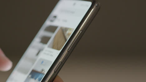 Close-Up-of-Scrolling-on-Pinterest-on-a-Phone-with-Copyspace