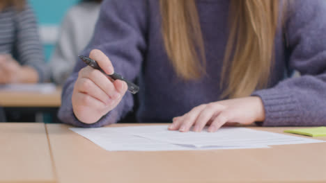 Close-Up-Shot-of-Students-Hand-During-Class