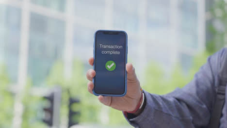 Close-Up-of-Transaction-Complete-Notification-on-Phone