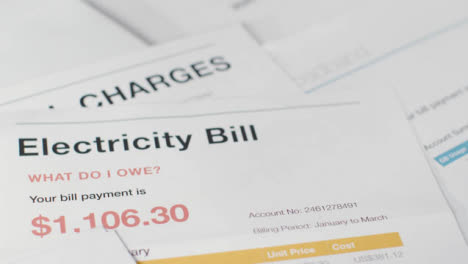 Close-Up-Of-US-Utility-Bills-With-Mobile-Phone-American-Rise-In-Cost-Of-Living