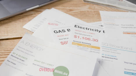 Close-Up-Of-Overdue-US-Utility-And-Service-Bills-On-Table-2