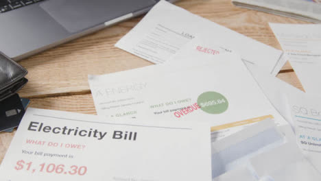 Close-Up-Of-Overdue-US-Utility-And-Service-Bills-On-Table-5