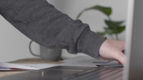 Close-Up-Of-Person-At-Laptop-Overdue-UK-Energy-Mortgage-And-Broadband-Bills-1