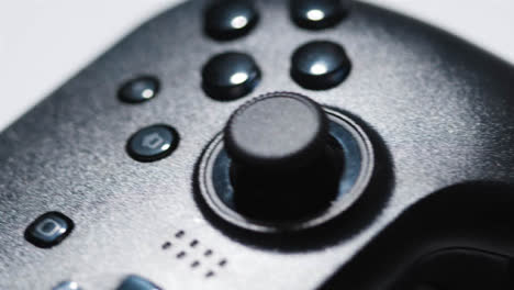 Studio-Close-Up-Of-Two-Video-Game-Controllers-Rotating-White-Background-1
