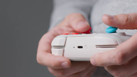 Side-On-Close-Up-Shot-Of-Hands-As-Man-Plays-With-Video-Game-Controller-2
