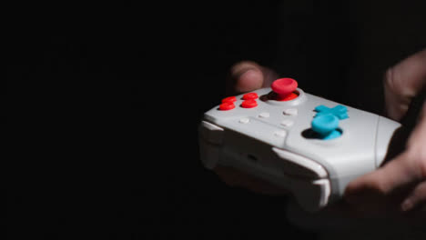 Side-On-Close-Up-Hands-Man-Playing-Video-Game-Controller-Low-Light-Background-5