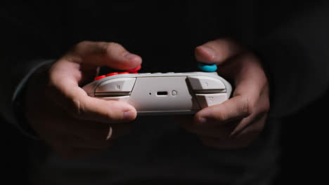 Side-On-Close-Up-Hands-Man-Playing-Video-Game-Controller-Low-Light-Background-6