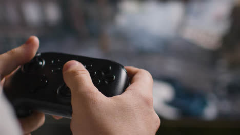 Close-Up-Hands-Man-Playing-Shooting-Video-Game-Controller-Screen-Background