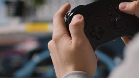 Close-Up-Hands-Man-Playing-Driving-Video-Game-Controller-Screen-Background-2