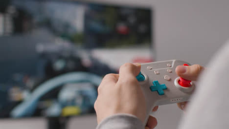 Close-Up-Hands-Man-Playing-Driving-Video-Game-Controller-Screen-Background-4