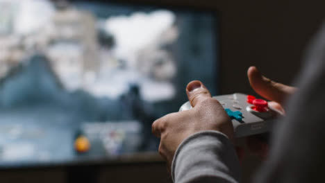 Close-Up-Hands-Man-Playing-Shooting-Video-Game-Controller-Screen-Background-2