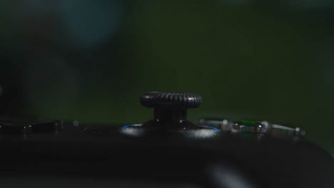 Close-Up-Macro-Video-Game-Controller-Game-On-Screen-In-Background-5