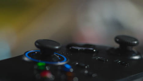 Close-Up-Macro-Video-Game-Controller-Game-On-Screen-In-Background-6