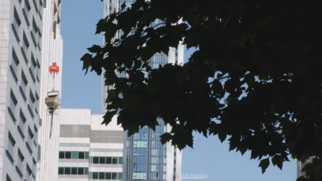 Modern-High-Rise-Offices-With-Construction-Crane-In-London-Docklands-UK