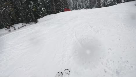 POV-Shot-Of-Skier-Skiing-Down-Snow-Covered-Slope