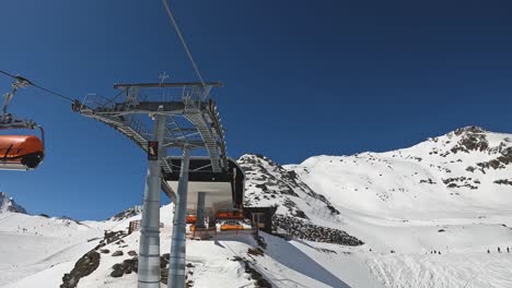 POV-Skiers-Getting-Off-Ski-Chair-Lift-Austria-Solden-Skiing-Station