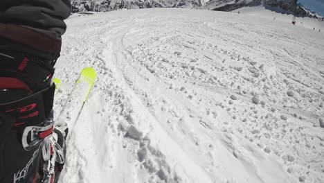 Low-Angle-POV-Skier-Skiing-Down-Snow-Mountain-Slope-Solden-Austria