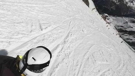 Action-Shot-Of-Skier-Skiing-Down-Snow-Covered-Mountain-Slope-Solden-Austria