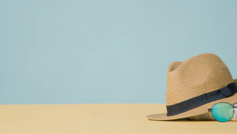 Summer-Holiday-Concept-Of-Sun-Hat-Sunglasses-On-Beach-Towel-2