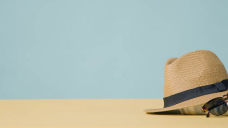 Summer-Holiday-Concept-Of-Sun-Hat-Sunglasses-On-Beach-Towel-3