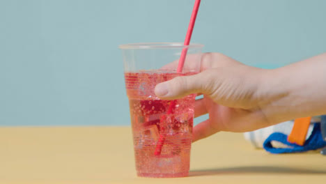 Summer-Holiday-Of-Concept-Cold-Drink-With-Sunglasses-On-Beach-Towel-1